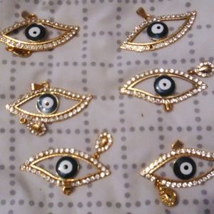 Six golden pendants like the last ones these eyes are different colors and they'
